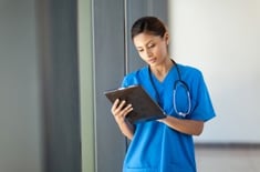 medical nurse using tablet computer
