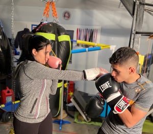 Practicing boxing with boy